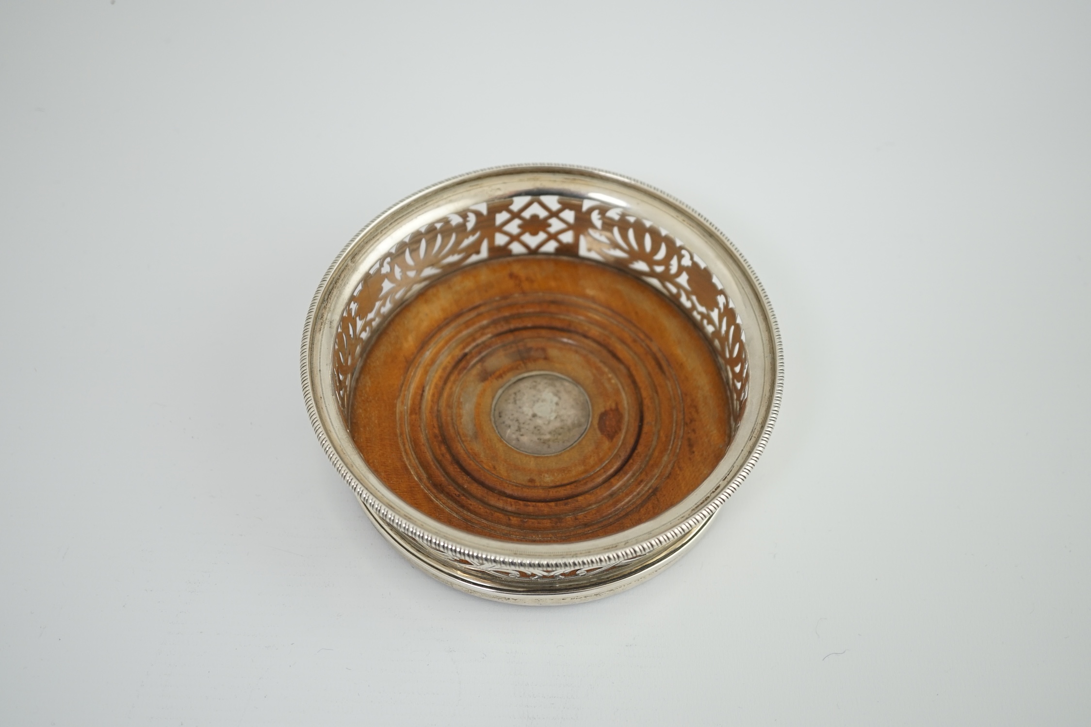 A George III pierced silver wine coaster, by William Allen III